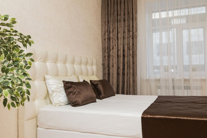 use a curtain to create a bedspread