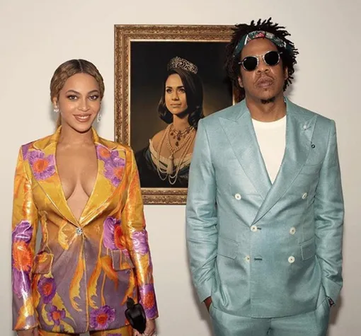 Бейонсе и Jay-Z с портретом Меган Маркл Бейонсе и Jay-Z с портретом Меган Маркл